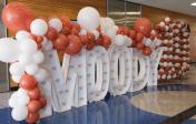 Balloons and letters that spell MOODY