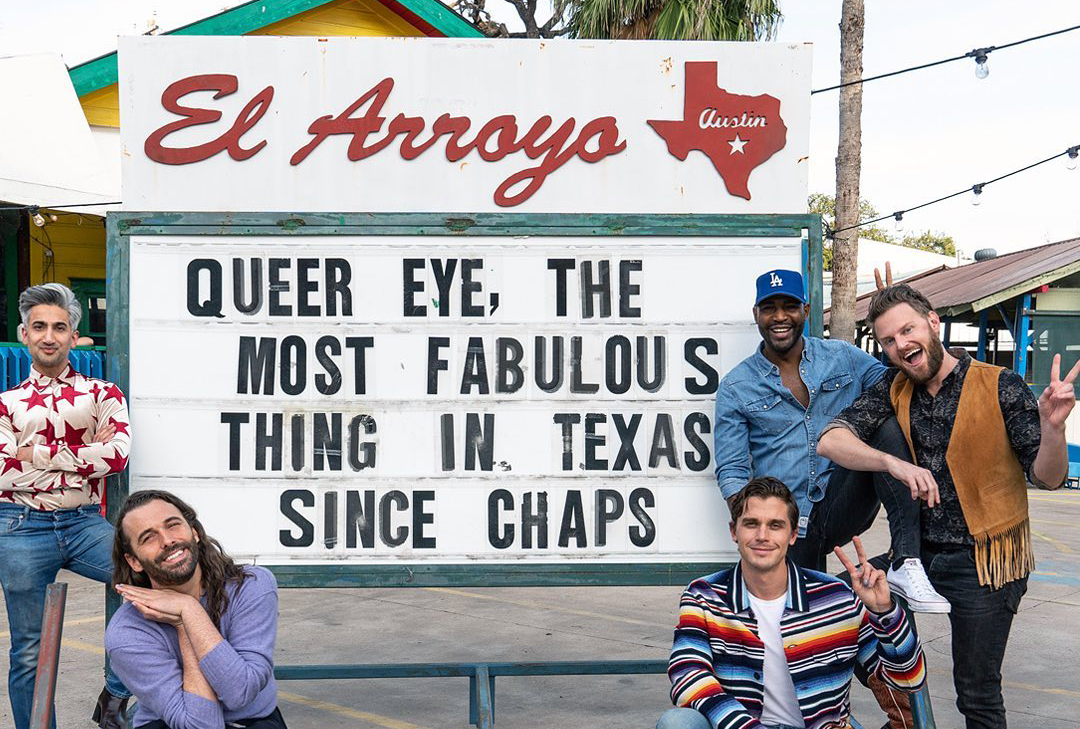 Five cast members from the Netflix reality show Queer Eye post in front of Austin's El Arroyo sign.