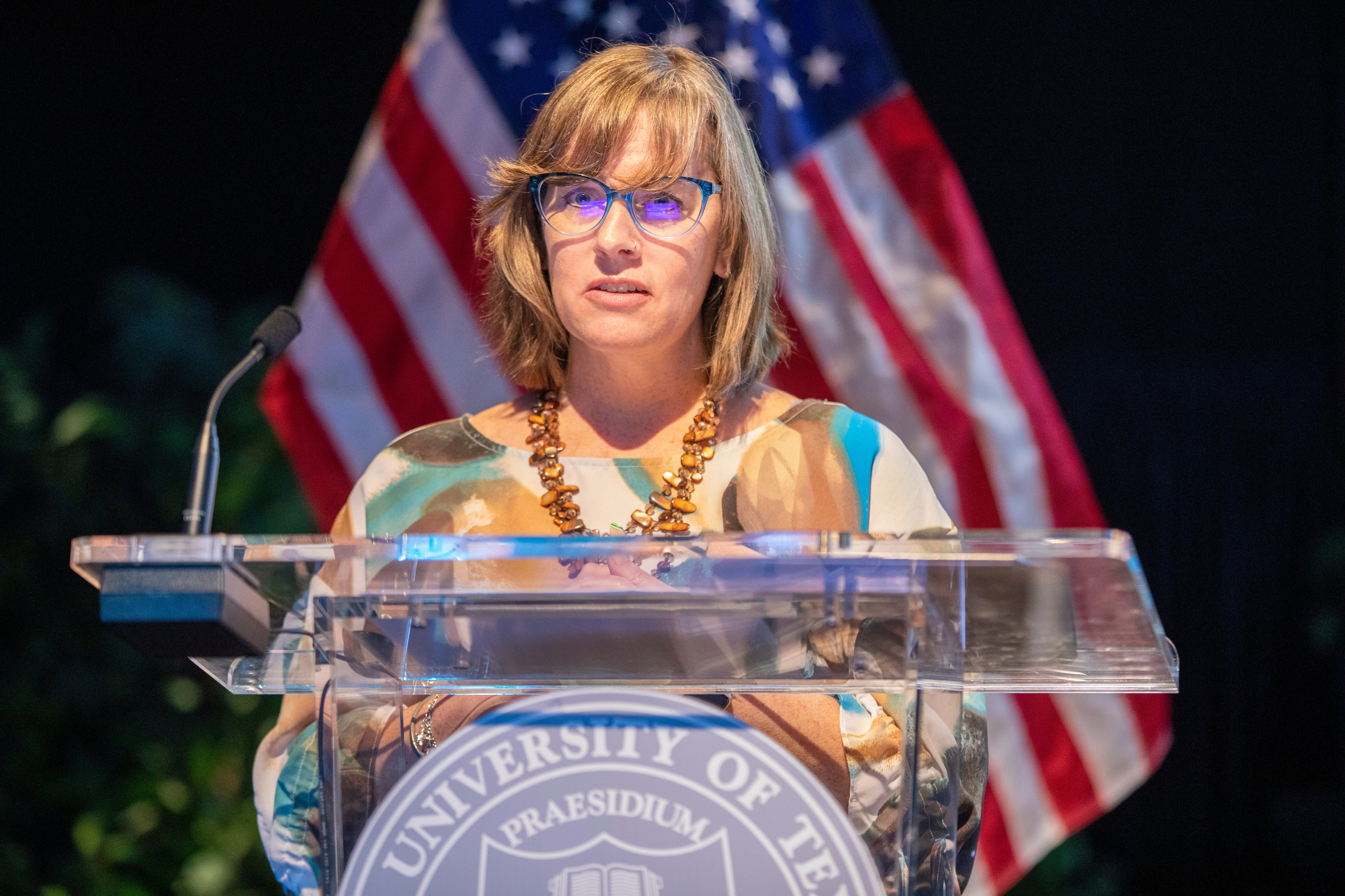 A staff member gives an awards speech.