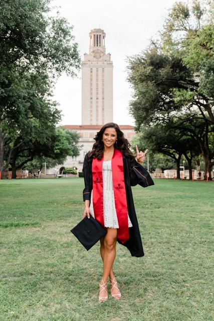 Photo of Emily Blank 2022 Moody College Graduate in front of the Tower