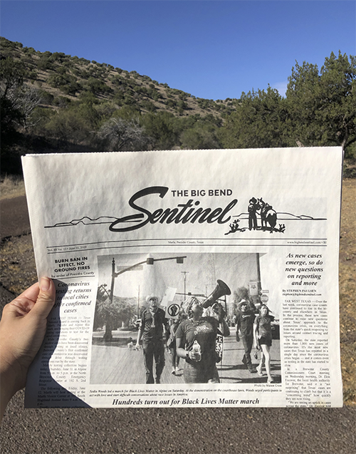 Photo of reader holding The Big Bend Sentinel