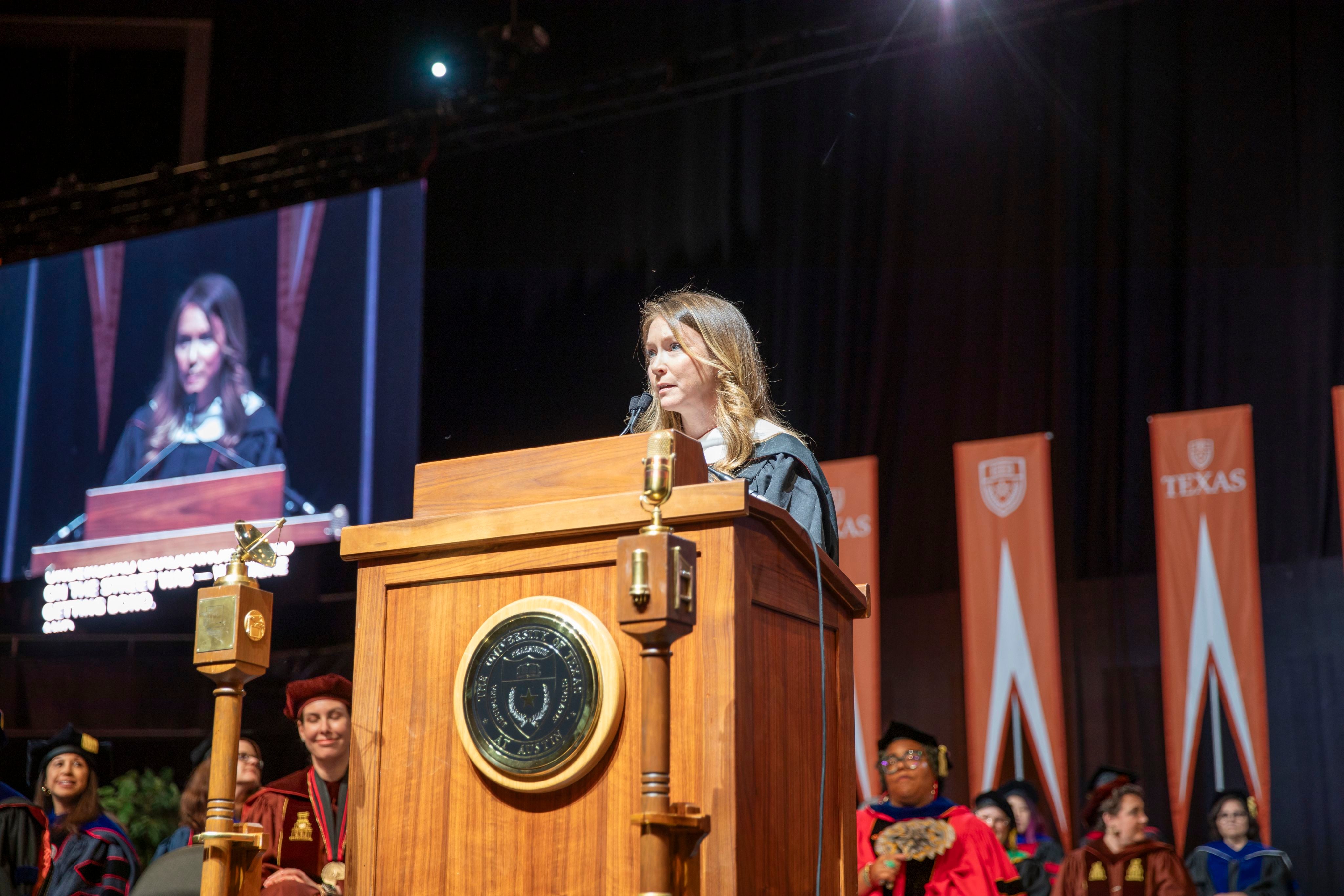 Alison Eakle at the podium at graduation 