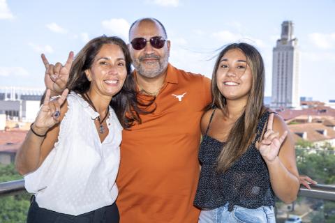 A photo of the Ortiz family in front of the UT Tower