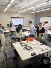 Students participating in a Stand up, Hand up, Pair up