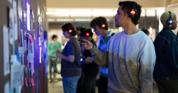 student at the pulse playtest wearing headphones