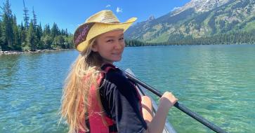 student kayaking 