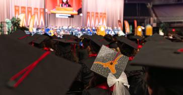 A graduation cap decorated with a Longhorn and bow