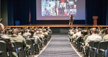 Kristen Christy speaking on stage
