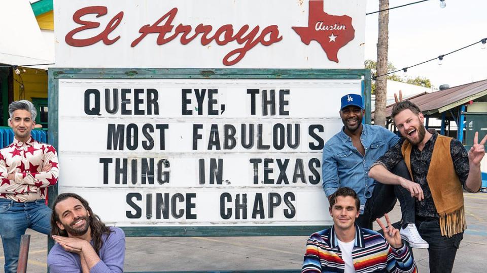 Five cast members from the Netflix reality show Queer Eye post in front of Austin's El Arroyo sign.