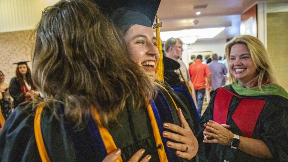 Moody College student celebrates graduation.