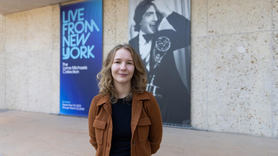 Grad student Ann Laudick standing in front of Harry Ranson Cemter 