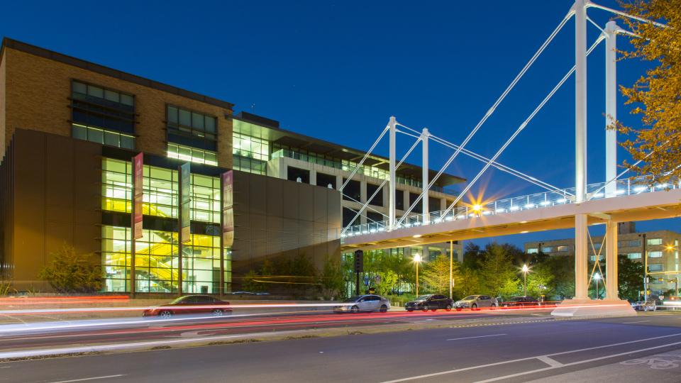 Moody College bridge at night