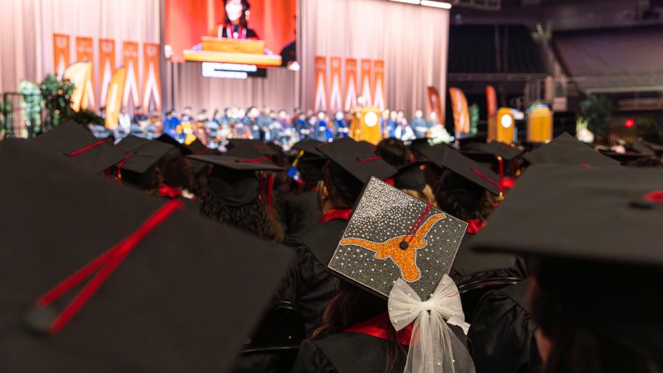 A graduation cap decorated with a Longhorn and bow