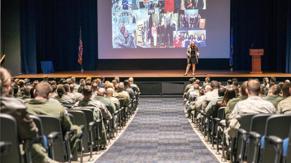 Kristen Christy speaking on stage