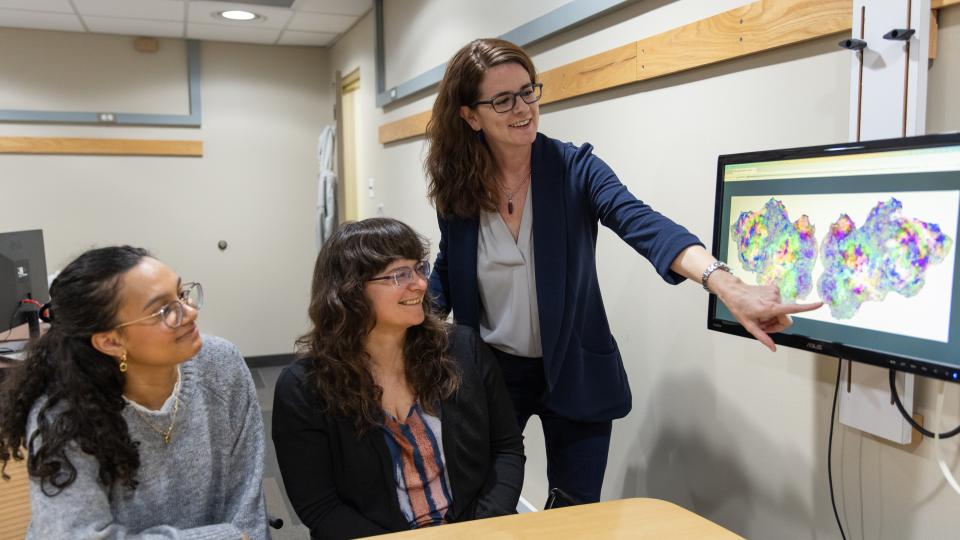 Maya Henry talking with students