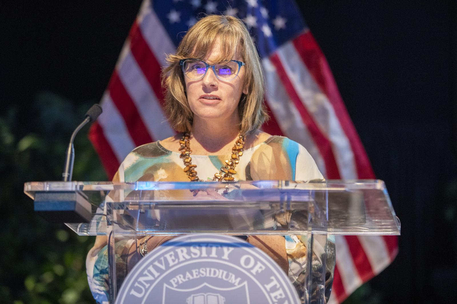 A staff member gives an awards speech.