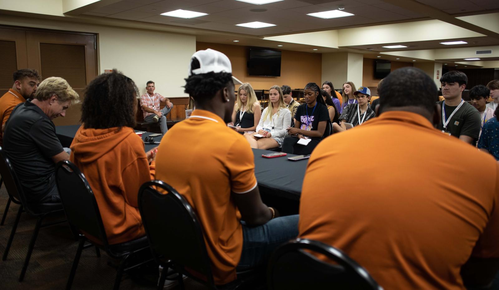 Texas high school students interview UT Austin athletes.