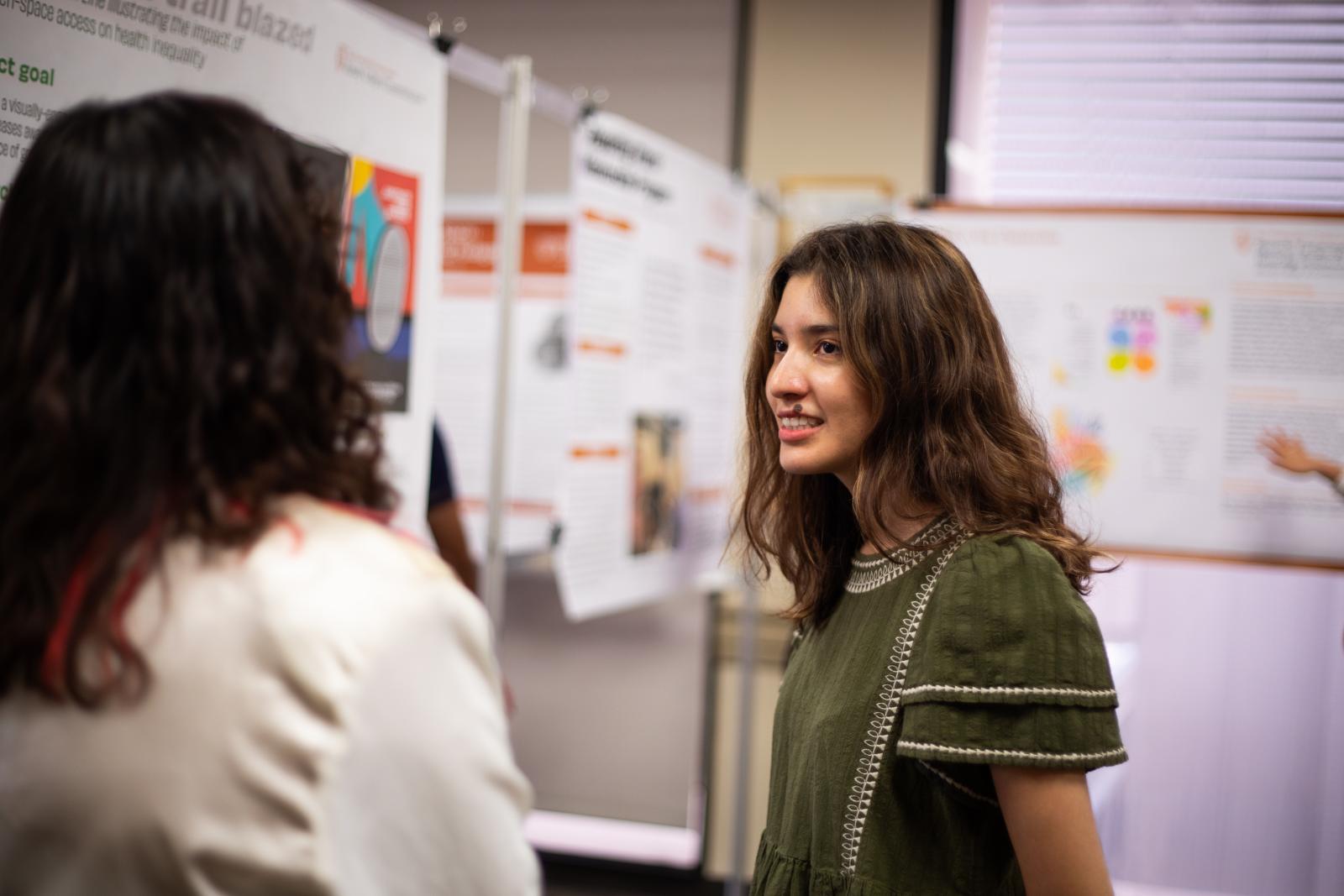 student Christine at poster session