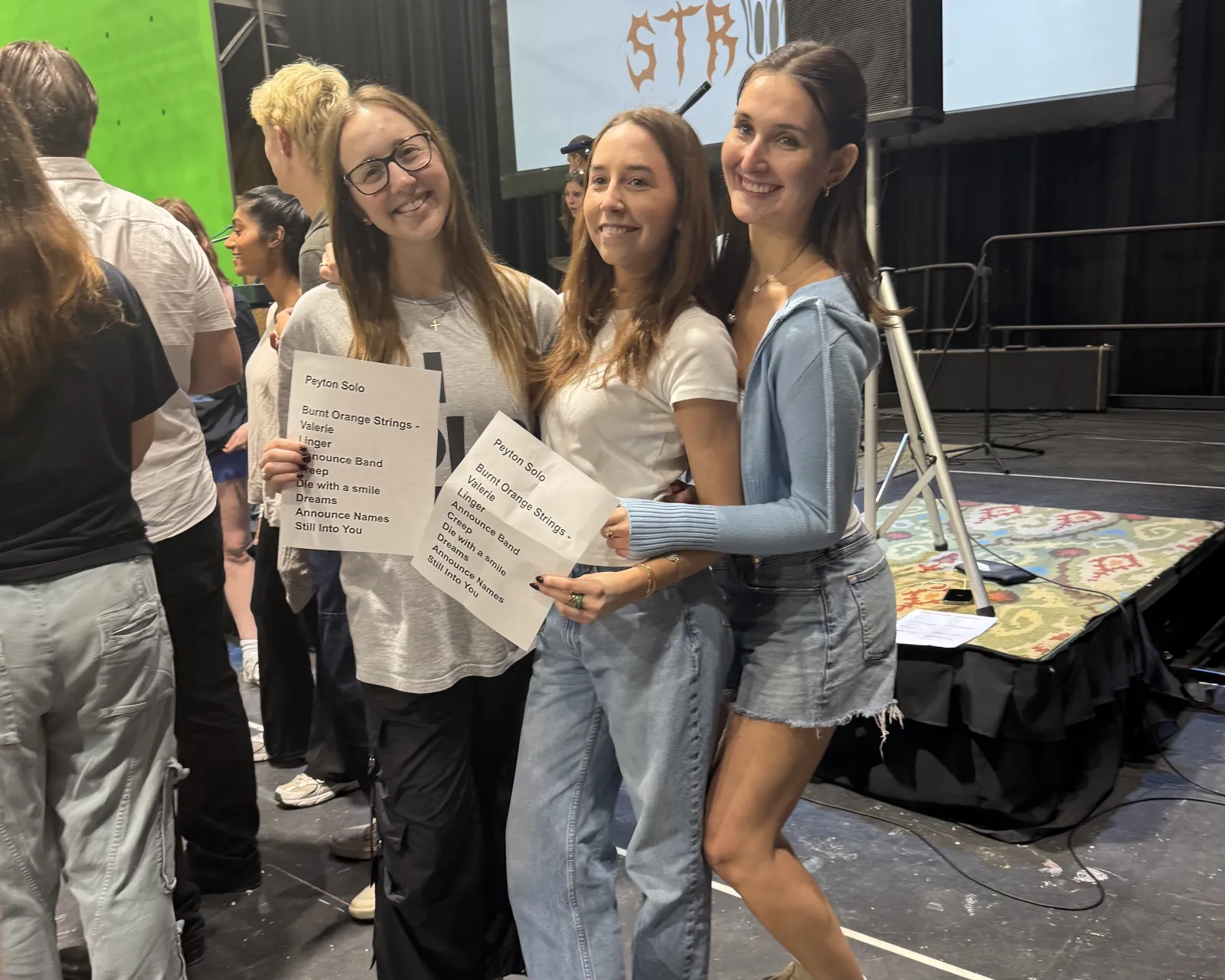 Students in charge of the concert set list and cue cards Students in charge of the concert set list and cue cards
