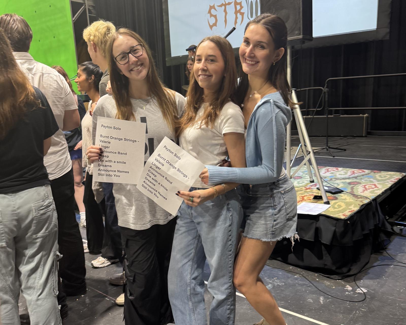 Students in charge of the concert set list and cue cards Students in charge of the concert set list and cue cards