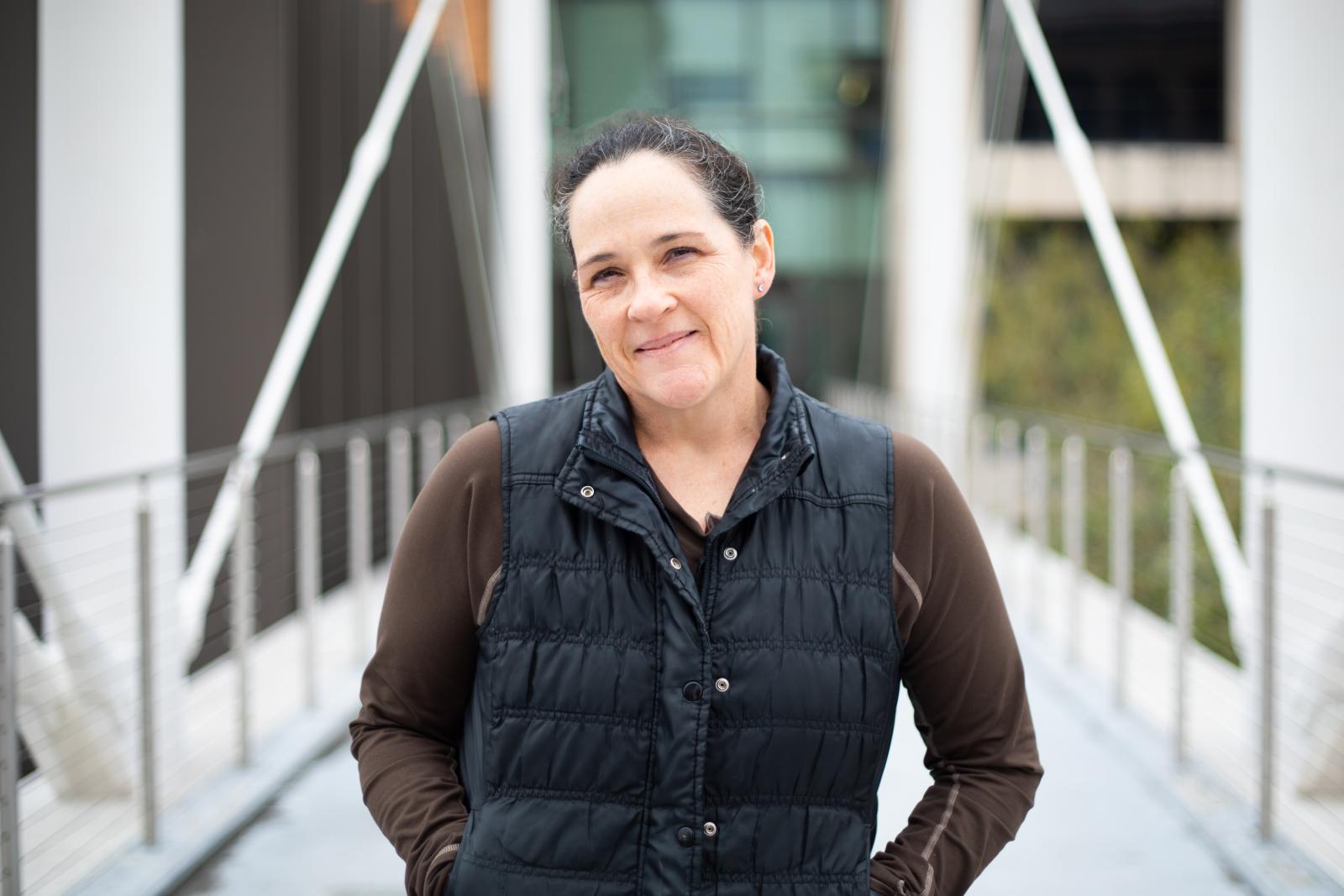 Journalism professor kate dawson standing on the moody bridge 