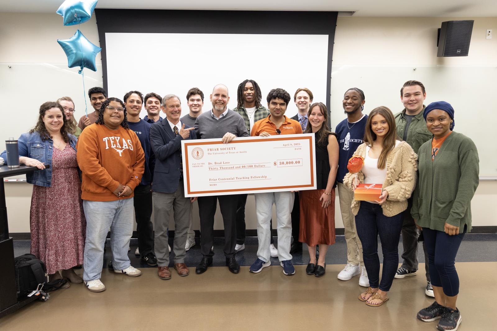 Dr. Brad Love presented with Friar Society award