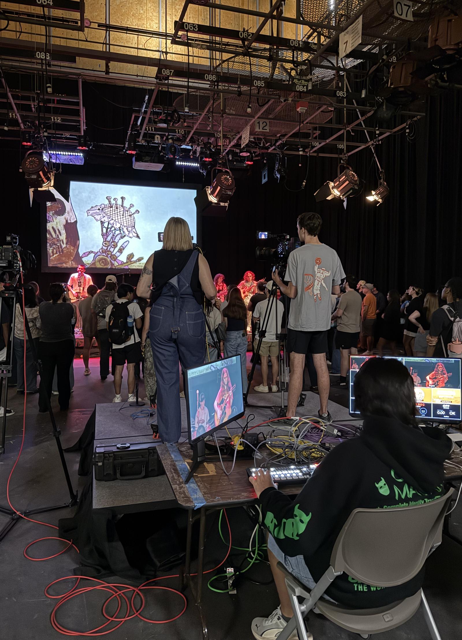 The full set of Red River Reverb, full of action during the show with camera operators and monitors, light and sound managers, and a crowd of cheering students