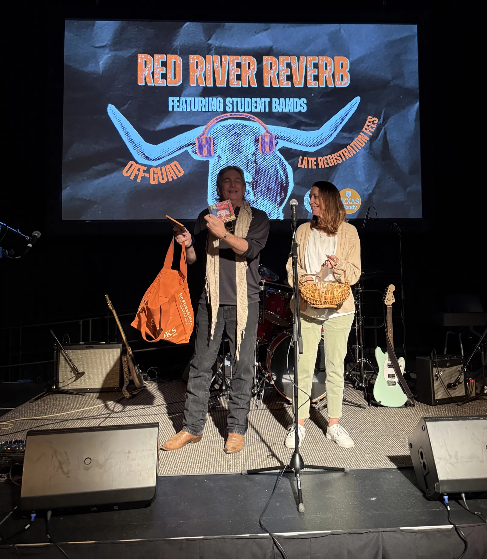 Instructor Peyton and Department Chair McCreery draw prizes on stage for Red River Reverb attendees