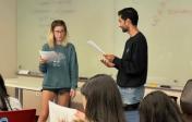 Two students act out a conflict resolution scene