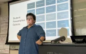 Dr. Czimskey standing in front of a classroom and giving instructions and guidelines on student's pbl product format choices