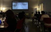 Image depicts students watching a film.