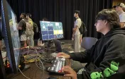 student handling computer equipment 