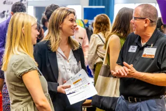 Students interact with a recruiter