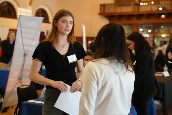 Student listens to a recruiter