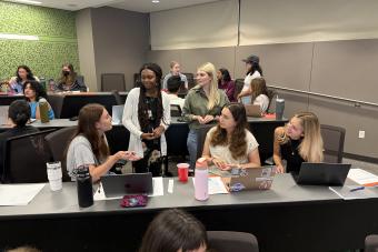 teaching assistants discussing an activity