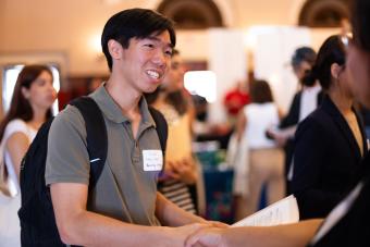 Student shakes hands with recruiter