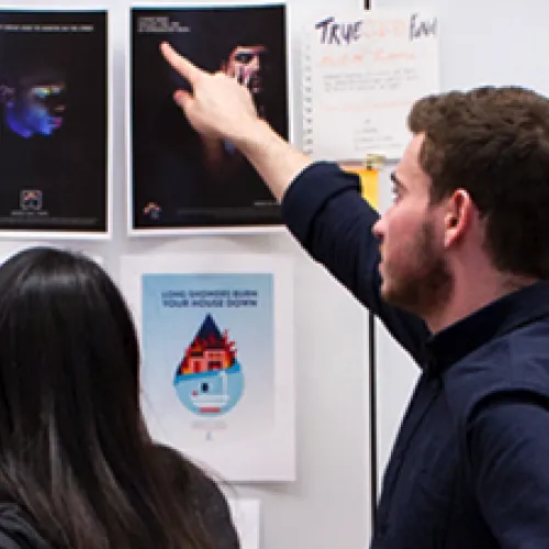 Students reviewing creative work