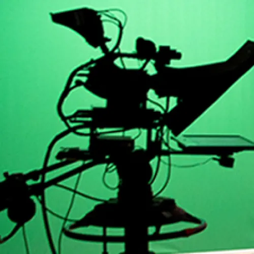 Image of film camera in front of green screen