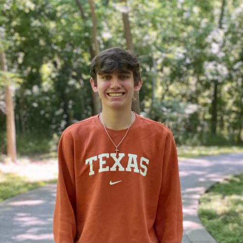 A college student in an orange Texas sweatshirt