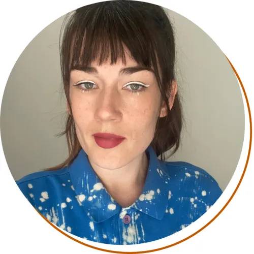 Headshot of Monika Jane Browatzki, shoulders up, blue shirt