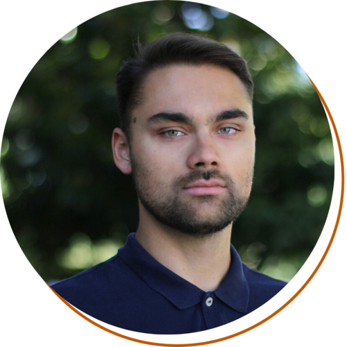 Christian Meola Profile Picture Headshot, Shoulders Up, Dark Blue Shirt, Green Background
