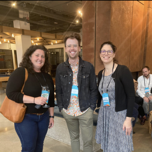 Three people (Jennifer Porst, Cory Barker, Alisa Perren) standing together at a conference