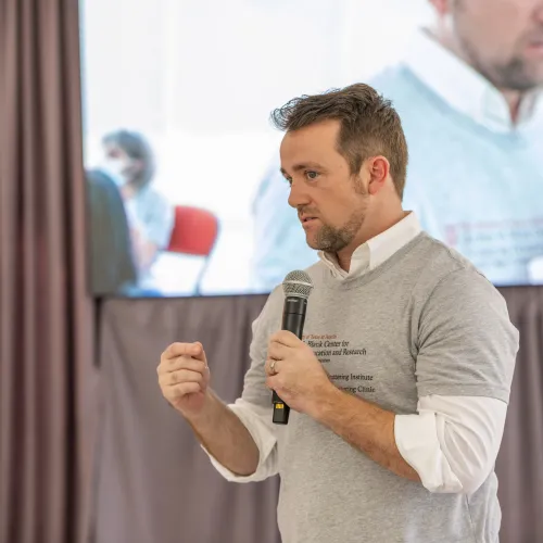 Client speaking at event