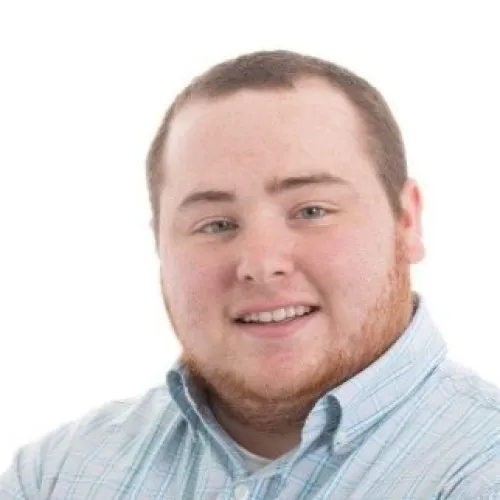 Headshot of a man smiling at the camera