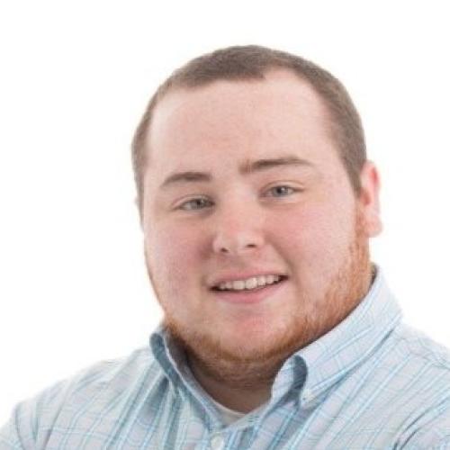 Headshot of a man smiling at the camera