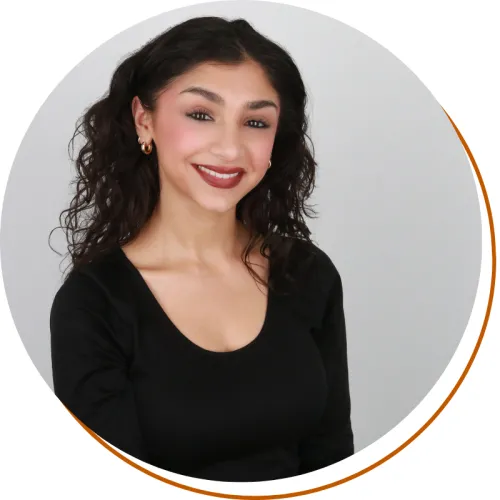 Firdous Khezrian Headshot, Dark shirt and long dark hair, white background