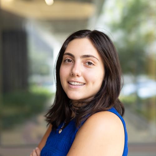 Portrait of a young woman with dark brown hair.