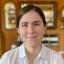 Headshot of Lindsay Bouchacourt, Ph.D., a white woman with brown hair pulled back in a white button down shirt smiling at the camera, and Research Associate at the Center for Health Communication.