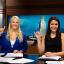 Students giving hookem sign
