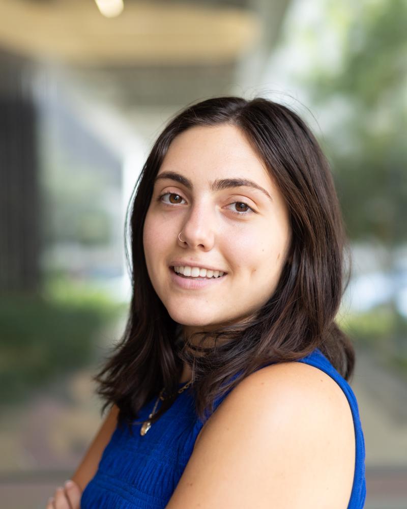 Portrait of a young woman with dark brown hair.
